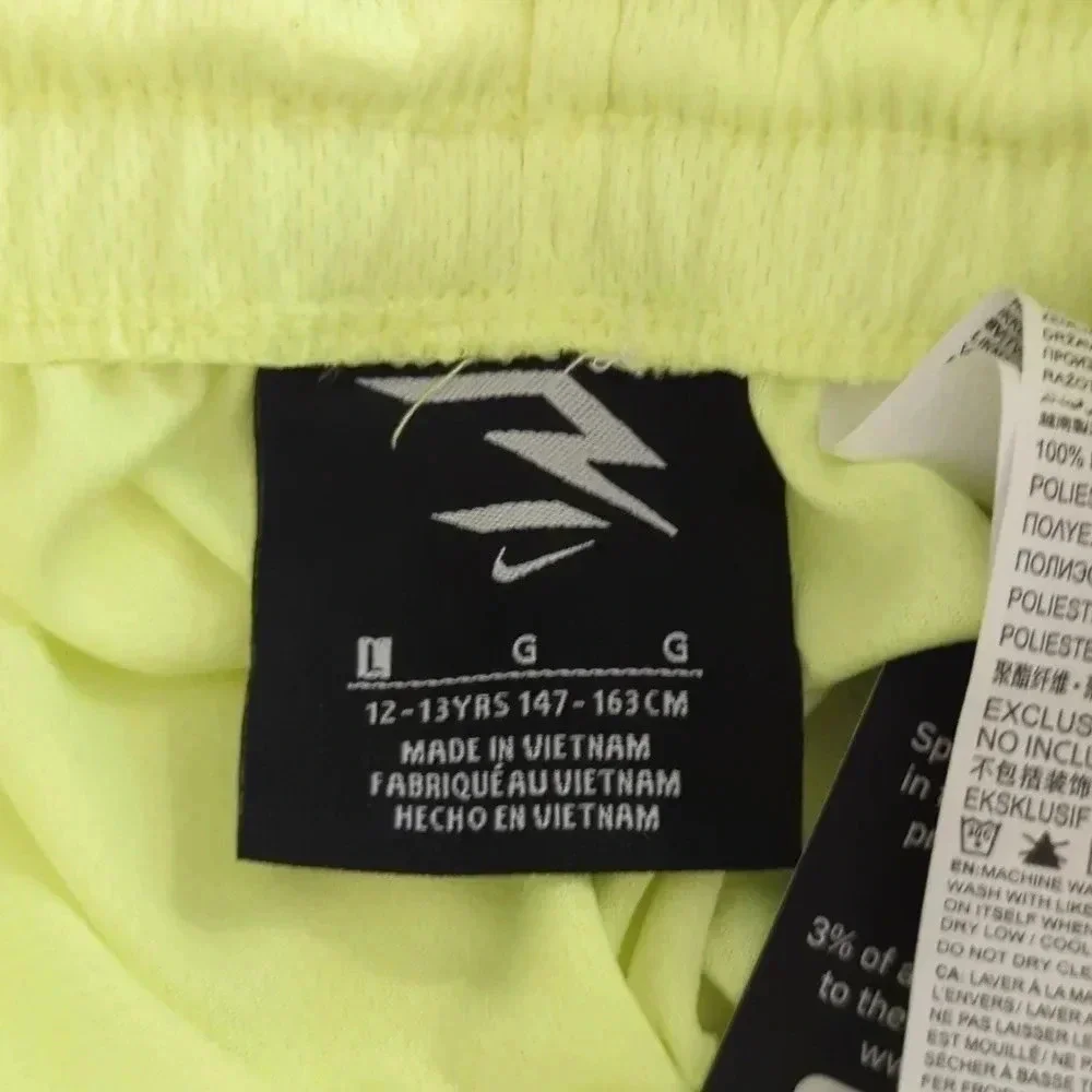 BOYS neon green Nike shorts